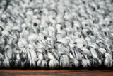 Grey mixture loop chunky wool rug weave close-up