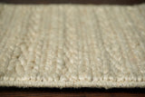 Ivory cream rug placed in a bedroom corner