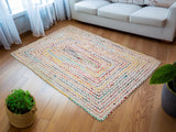 Rainbow chindi rag rug laid flat showing full striped pattern