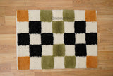 Checkered chunky loop wool rug flat lay