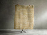 Ivory jute rug styled in a living room
