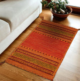 Vibrant orange kilim rug flat lay full view