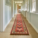 Red kilim rug styled in a living room setting