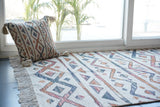 Striped Moroccan ivory rug laid flat showing full pattern