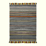 Grey striped rug styled in a bedroom
