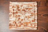 Close-up of chunky wool loop pile texture