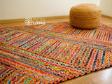 Rainbow striped rag rug styled in an entryway setting