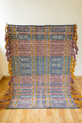 Tribal pattern detail on blue-purple PET yarn kilim rug