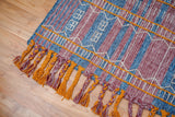 Kilim rug in bedroom setting with natural light