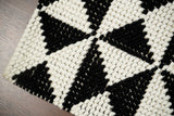 Checkered wool rug in a Scandinavian styled room