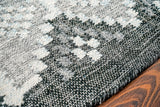 Gray outdoor rug under patio furniture