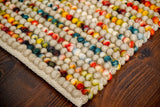 Striped wool rug styled in a living room