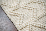 Abstract ivory chunky wool rug pattern detail