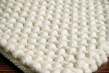 Ivory loop chunky wool rug weave close-up