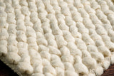Ivory chunky rug in bedroom setting