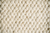 Ivory wool rug corner detail