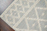 Grey wool rug under natural light
