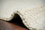 Rug corner detail showing pebble texture