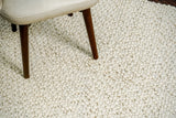 Ivory rug placed under furniture in bedroom