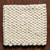 Close-up of ivory rug chunky loop texture