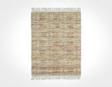 Chunky looped wool rug rolled for shipping