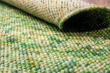 Sage green chunky loop wool rug, flat lay view