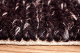 Full room view with cola brown wool rug