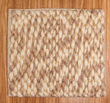 Taupe beige wool rug pile texture close-up