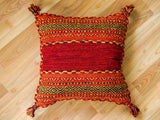 Diamond pattern detail on red cotton chenille rug