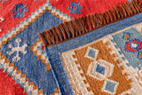 Aztec pattern kilim rug on a covered patio