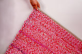 Full view of pink chindi rug in natural light