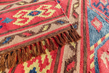 Close-up of the red geometric flatweave pattern