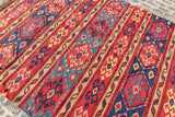 Red Afghan style kilim rug corner detail