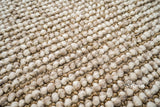 Chunky wool rug styled beside furniture