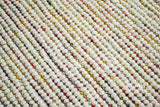 Chunky wool rug pile close-up showing color blend