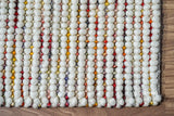 Colourful wool rug styled with kids furniture