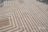 Beige rustic kilim rug under a chair