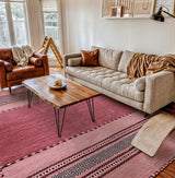 Pink kilim rug styled in a living room