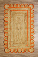 Orange jute rug rolled to show thickness and edge