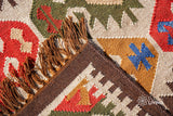 Multicolour kilim rug in a boho styled living room