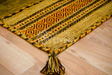 Green kilim rug styled in a living room