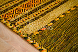 Close-up of cotton chenille weave on green kilim rug