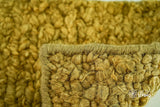 Olive green wool rug in a modern room styling