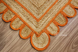 Full-length overhead view of orange scallop jute rug