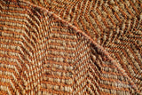 Orange jute round rug edge detail