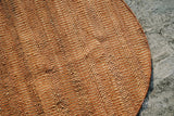 Orange jute round rug full view from above