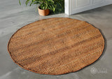 Natural orange round jute rug flat lay showing woven texture