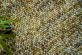 Close-up of green wool basketweave texture