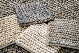Wool jute pebble rug styled in a living room