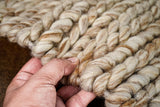 Beige brown wool rug texture close-up